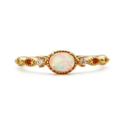Gold plated sterling silver ring with oval synthetic opal and cubic zirconia accents