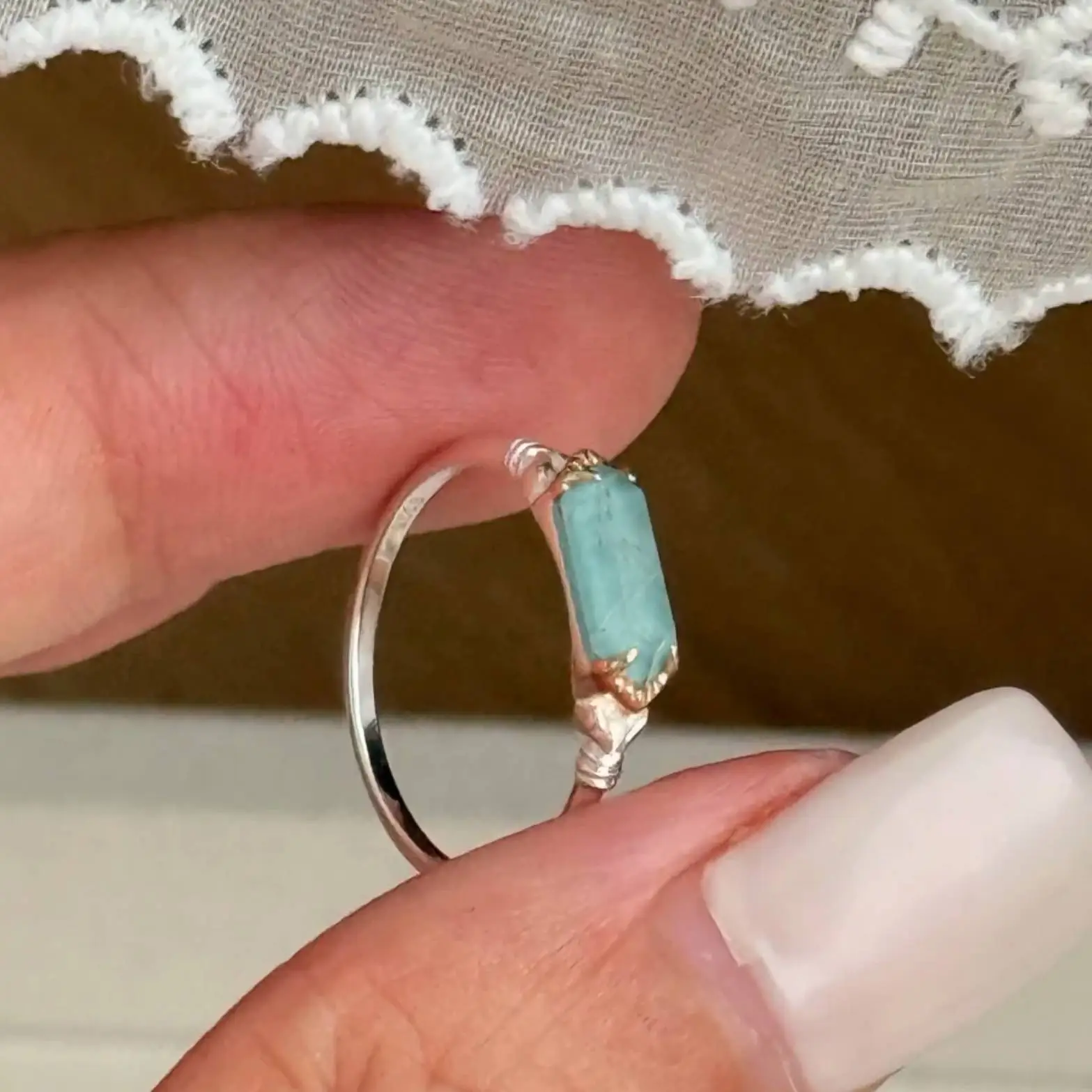 925 sterling silver ring featuring a rectangular bar-cut natural sea green rutilated quartz stone with subtle wire wrapping details