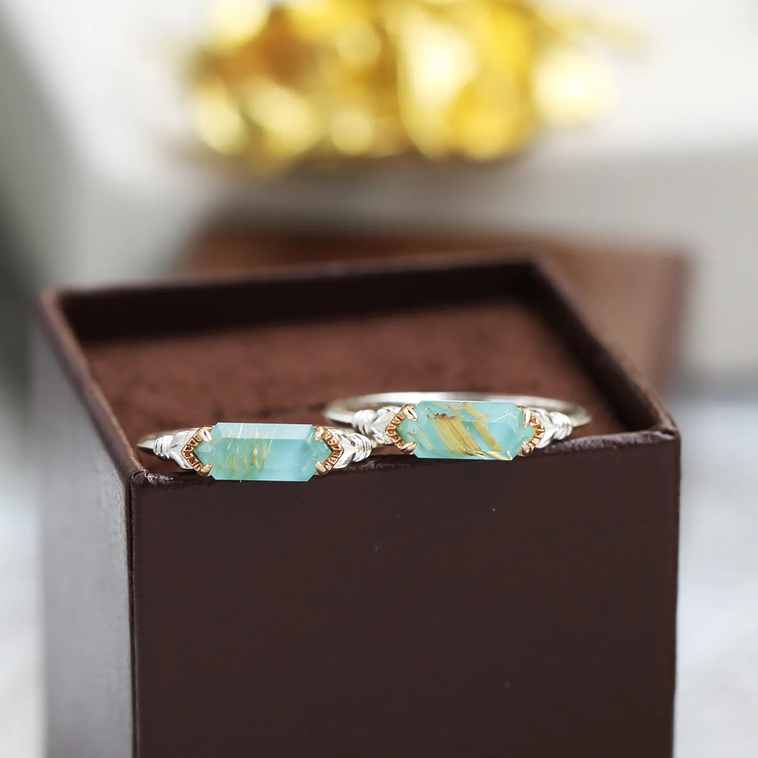 925 sterling silver ring featuring a rectangular bar-cut natural sea green rutilated quartz stone with subtle wire wrapping details
