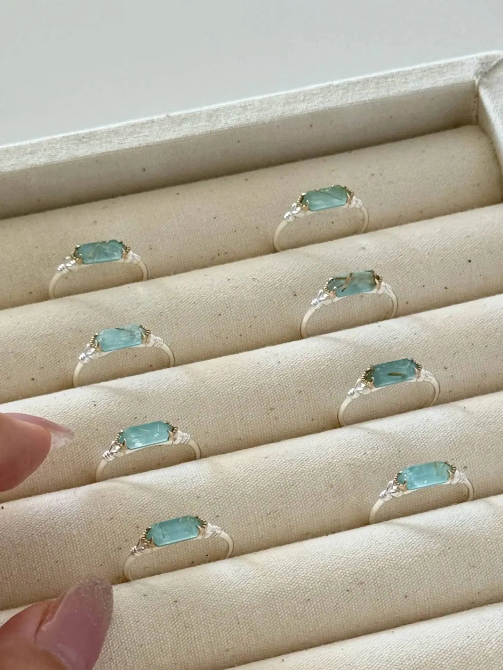 925 sterling silver ring featuring a rectangular bar-cut natural sea green rutilated quartz stone with subtle wire wrapping details