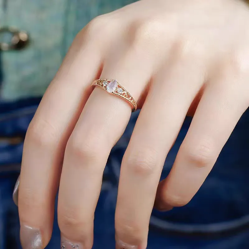 Gold-plated 925 sterling silver vintage ring featuring a pear-cut natural labradorite stone surrounded by floral vine filigree details and cubic zirconia accents