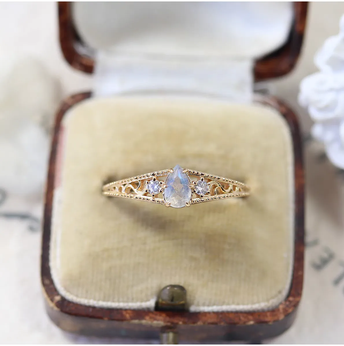 Gold-plated 925 sterling silver vintage ring featuring a pear-cut natural labradorite stone surrounded by floral vine filigree details and cubic zirconia accents