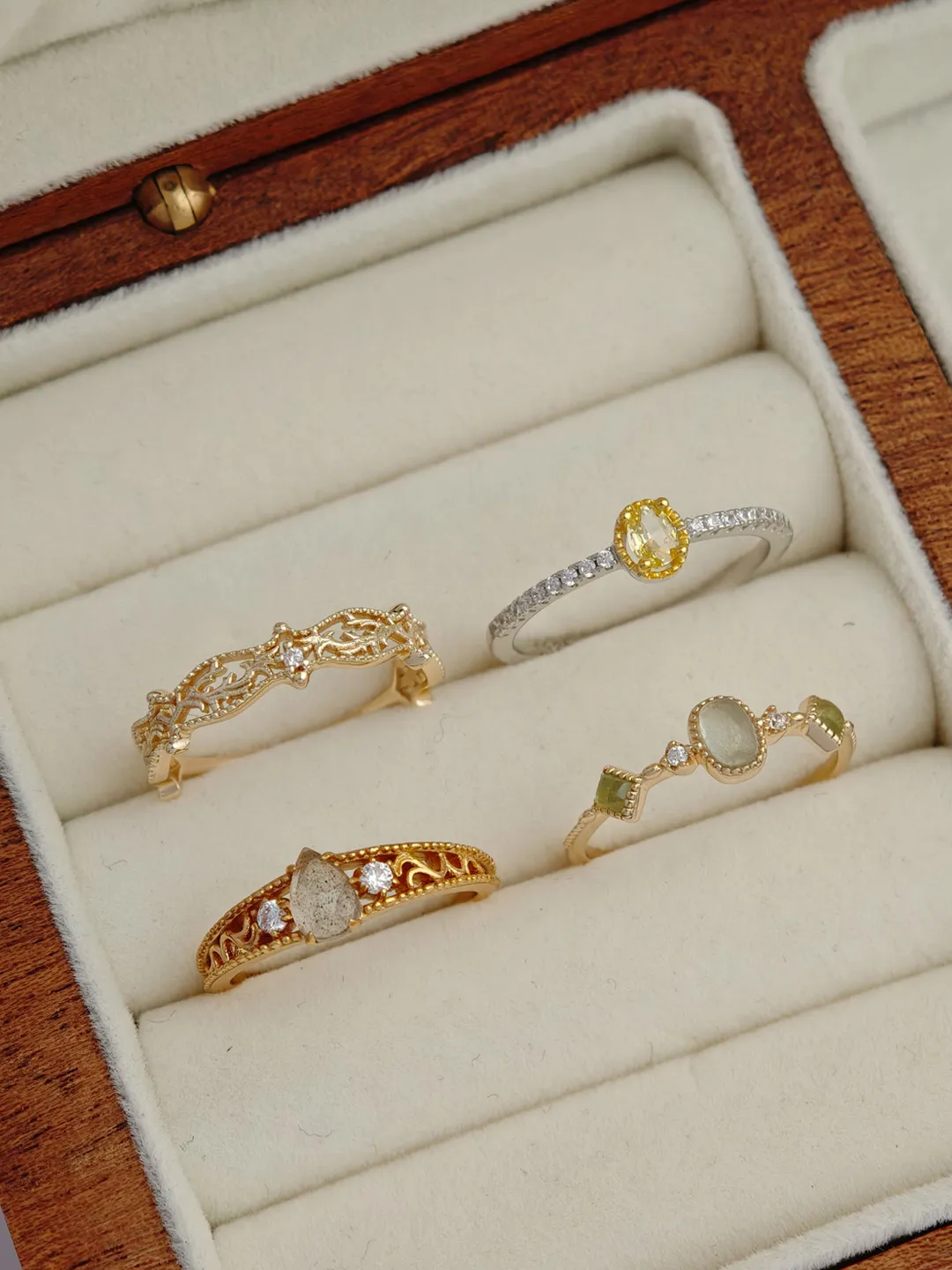 Gold-plated 925 sterling silver vintage ring featuring a pear-cut natural labradorite stone surrounded by floral vine filigree details and cubic zirconia accents