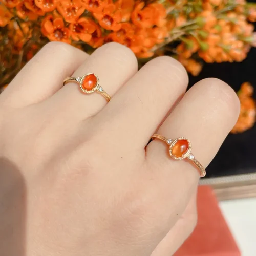 14K gold plated 925 sterling silver vintage ring featuring an oval natural amber stone centerpiece flanked by white zircon accents with engraved band detailing