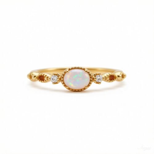 Gold plated sterling silver ring with oval synthetic opal and cubic zirconia accents
