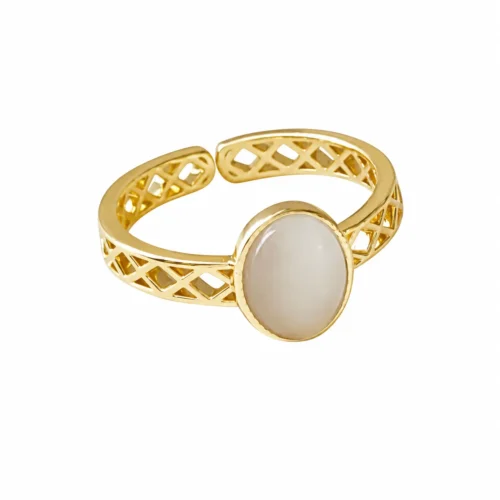 Front view of a 14K gold-plated French vintage adjustable ring featuring an oval white moonlight cat's eye stone and a lattice cutout band