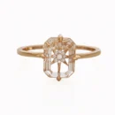 Front view of a white crystal ring with a zircon star in a gold-plated band