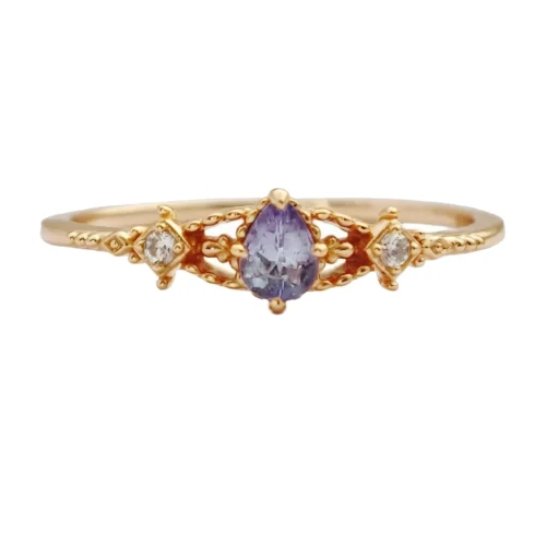 Front view of the 14K gold-plated vintage ring featuring a pear-shaped purple tanzanite stone on a white background.